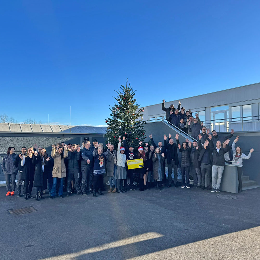 Christmas tree with PAYER employees on company premises